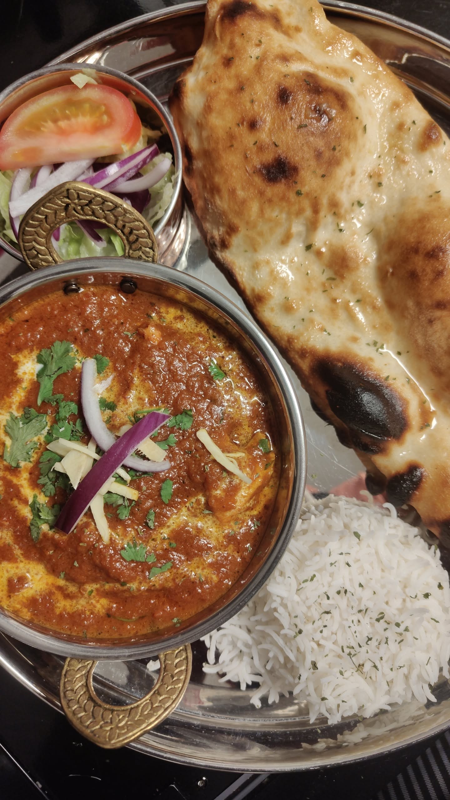 Authentic Indian curry with naan bread and rice